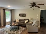 Open concept with comfortable couch and TV